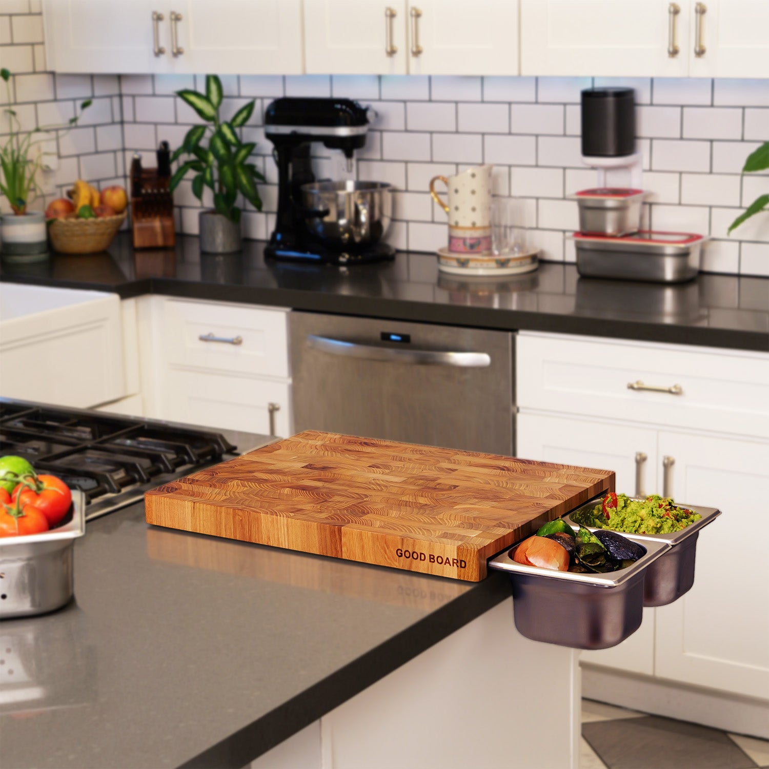 Good Board meal prep system in action, showcasing chopped vegetables, freshly made guacamole, and food scraps in steel containers, placed in a stylishly clean kitchen.
