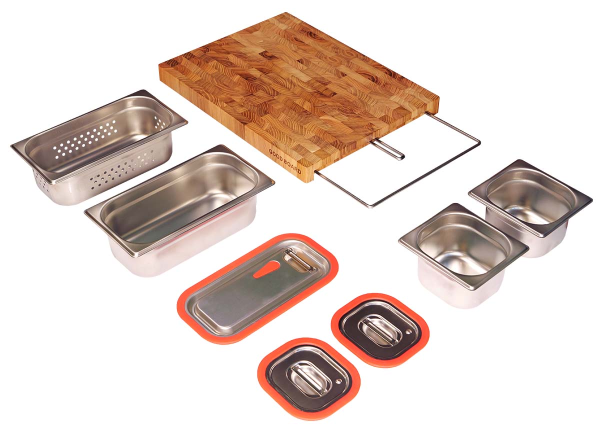Image showcasing the complete Good Board system on a white background: teak cutting board, tray system, two small containers with lids, one large container with lid, and a colander.